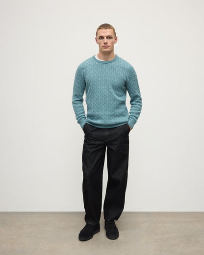Model wearing Johnstons of Elgin AW25 Men's Knitwear Seascape Cable Knit Green Cashmere Jumper Front KAI05693HC0038