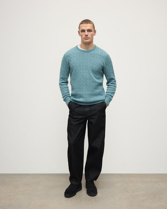Model wearing Johnstons of Elgin AW25 Men's Knitwear Seascape Cable Knit Green Cashmere Jumper Front KAI05693HC0038