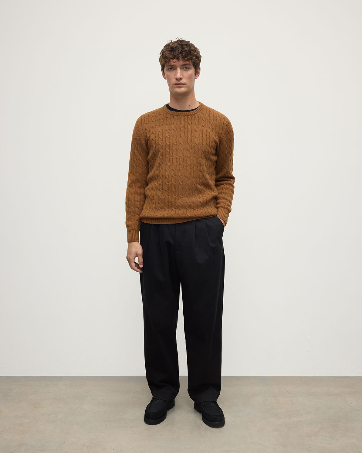 Model wearing Johnstons of Elgin AW25 Men's Knitwear Dark Camel Cable Knit Camel Cashmere Jumper Front KAI05693SB4620