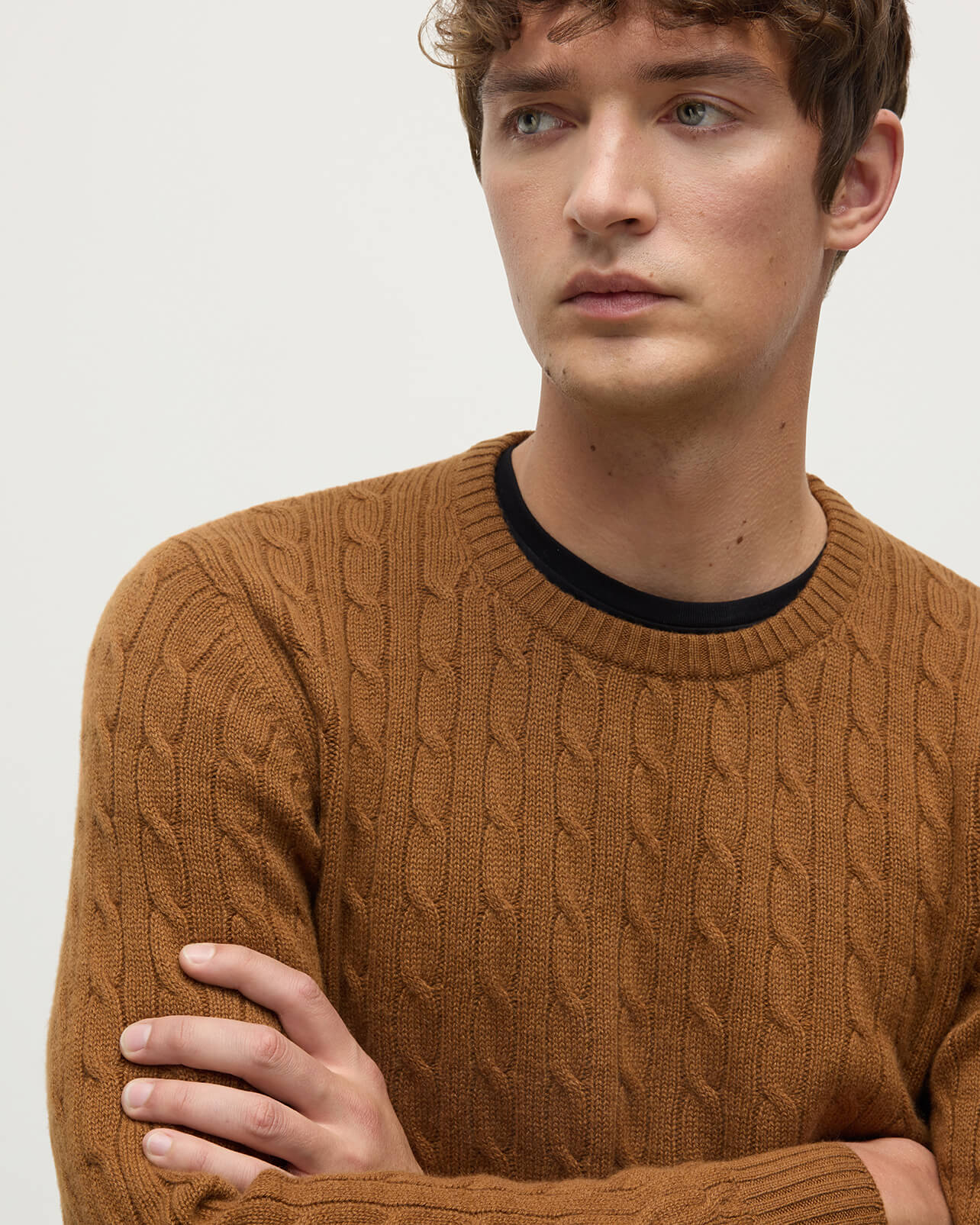 Model wearing Johnstons of Elgin AW25 Men's Knitwear Dark Camel Cable Knit Camel Cashmere Jumper Details KAI05693SB4620