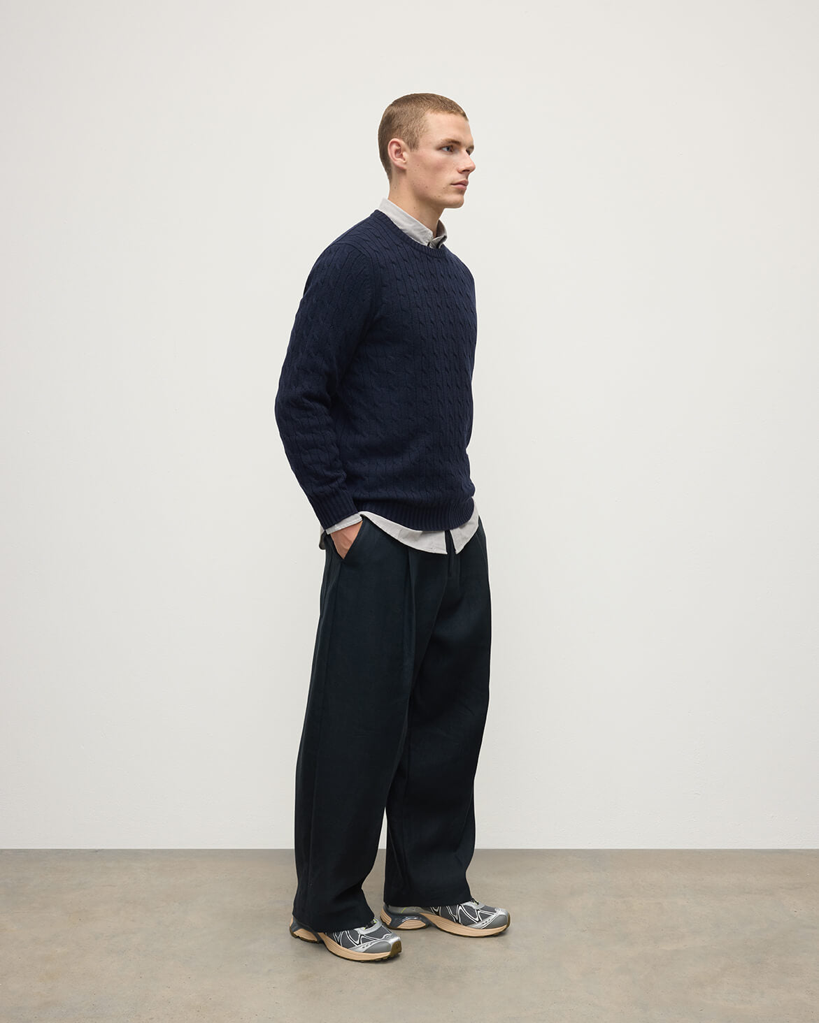 Model is wearing Johnstons of Elgin AW25 Men's Knitwear Dark Navy Cable Knit Navy Cashmere Jumper Front KAI05693SD7666