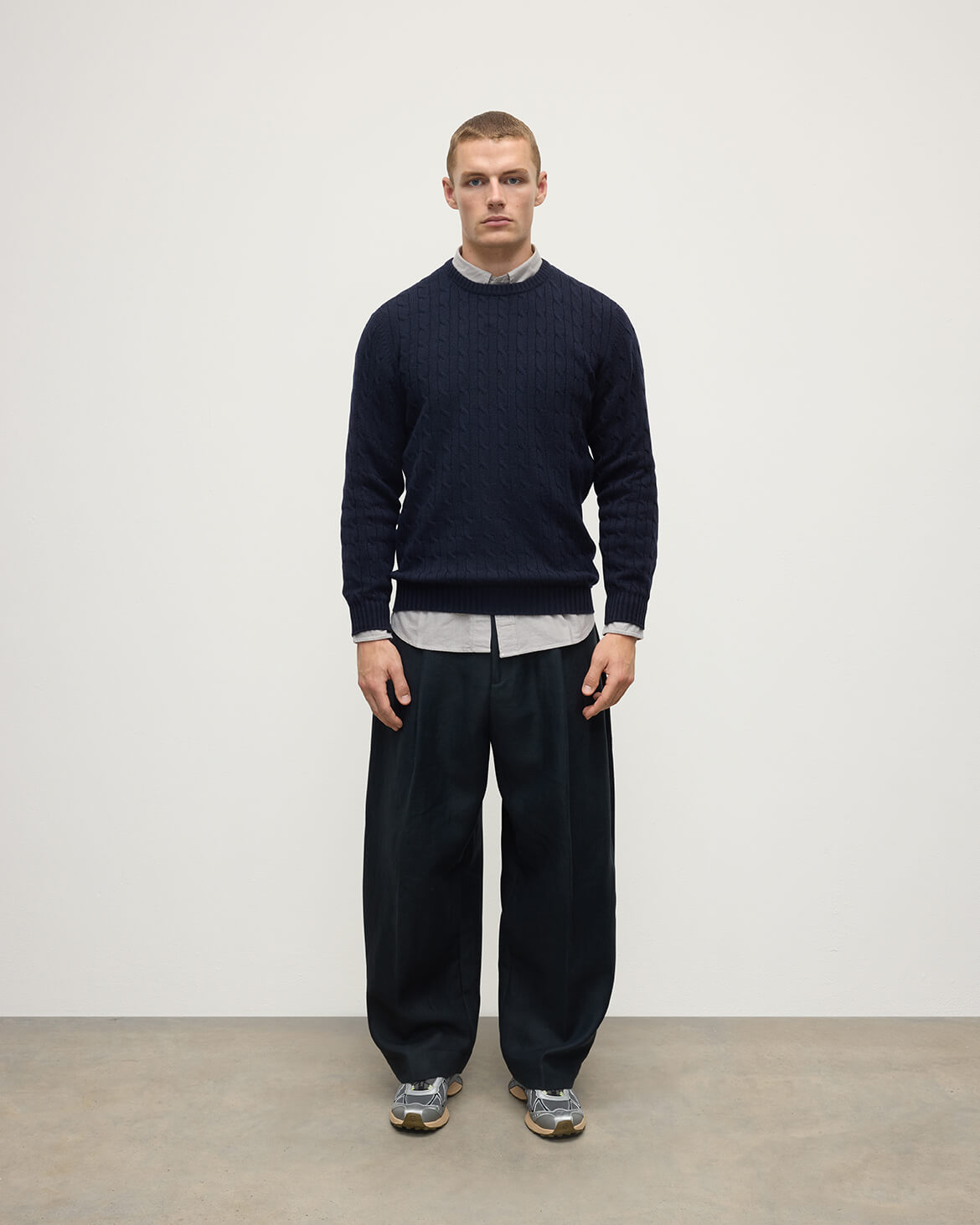 Model is wearing Johnstons of Elgin AW25 Men's Knitwear Dark Navy Cable Knit Navy Cashmere Jumper Front KAI05693SD7666