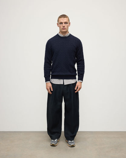 Model is wearing Johnstons of Elgin AW25 Men's Knitwear Dark Navy Cable Knit Navy Cashmere Jumper Front KAI05693SD7666