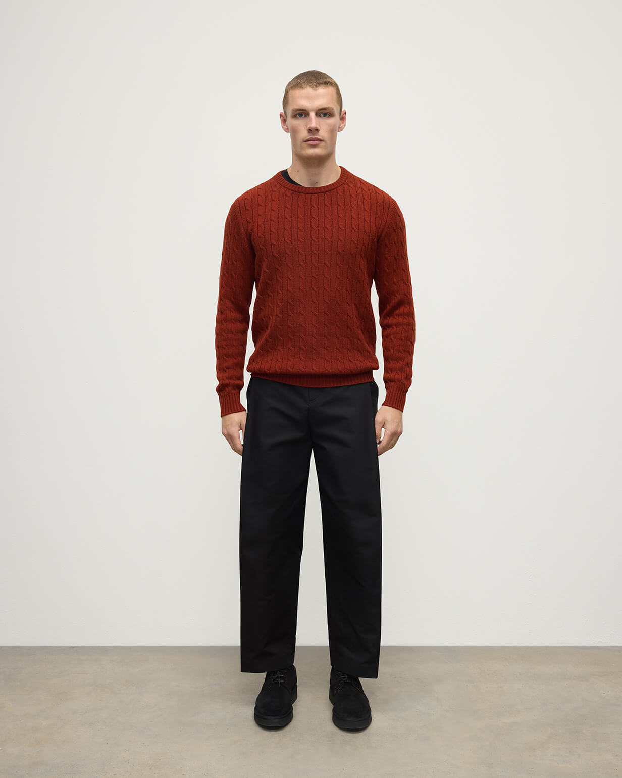 Model wearing Johnstons of Elgin AW25 Men's Knitwear Oxblood Cable Knit Red Cashmere Jumper Front KAI05693SG4463