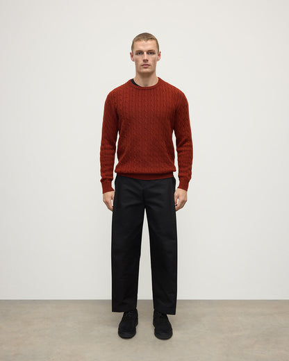 Model wearing Johnstons of Elgin AW25 Men's Knitwear Oxblood Cable Knit Red Cashmere Jumper Front KAI05693SG4463