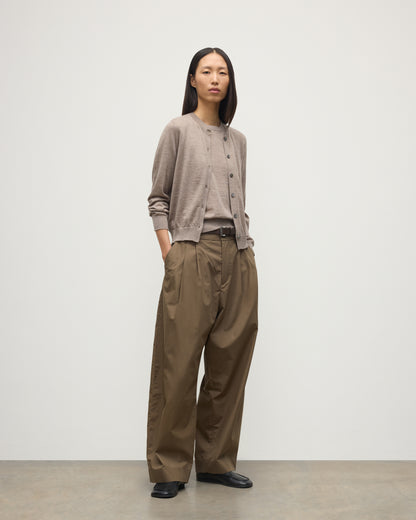 MODEL WEARING JOHNSTONS OF ELGIN WOMENS HONOR CREW CARDIGAN LIGHT BROWN 100% SUPERFINE CASHMERE WITH BROWN WIDE LEG TROUSERS AND BLACK LOAFERS KAI05708HB0273