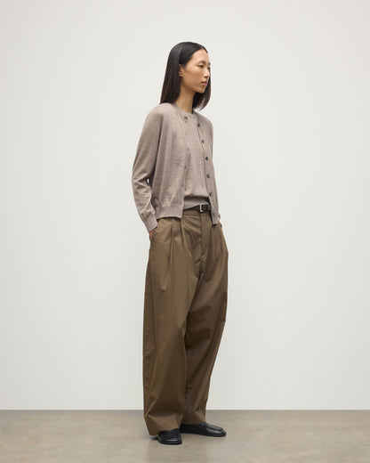 MODEL WEARING JOHNSTONS OF ELGIN WOMENS HONOR CREW CARDIGAN LIGHT BROWN 100% SUPERFINE CASHMERE OVER A MATCHING CASHMERE T-SHIRT WITH BROWN WIDE LEG TROUSERS  KAI05708HB0273
