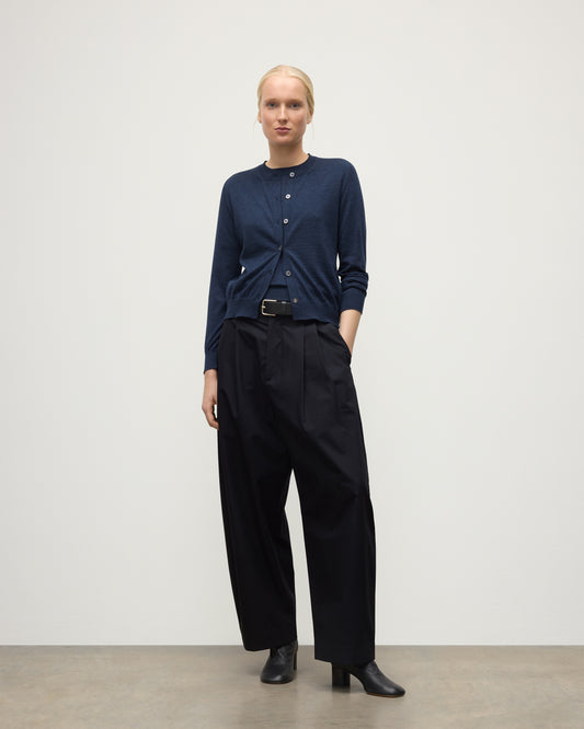 MODEL WEARS JOHHNSTONS OF ELGIN WOMENS HONOR CREW CARDIGAN NAVY 100% SUPERFINE CASHMERE OVER MATCHING CASHMERE T-SHIRT & BLACK TROUSERS KAI05708HD7350