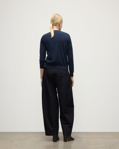 MODEL WEARS JOHHNSTONS OF ELGIN WOMENS HONOR CREW CARDIGAN NAVY 100% SUPERFINE CASHMERE  & BLACK TROUSERS KAI05708HD7350