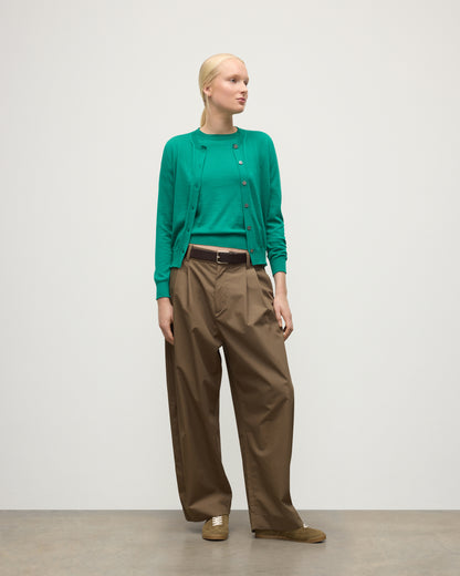 MODEL WEARING JOHNSTONS OF ELGIN WOMENS HONOR CREW CARDIGAN GREEN 100% SUPERFINE CASHMERE WITH BROWN BELTED CHINOS KAI05708SC4714