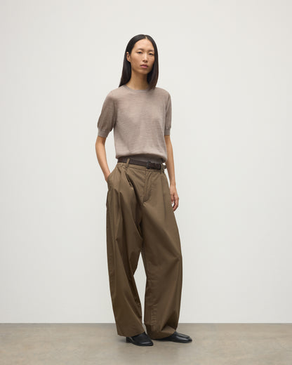 MODEL WEARING JOHNSTONS OF ELGIN WOMENS HONOR SHORT SLEEVE CREW LIGHT BROWN 100% SUPERFINE CASHMERE WITH BROWN WIDE LEG TROUSER KAI05712HB0273