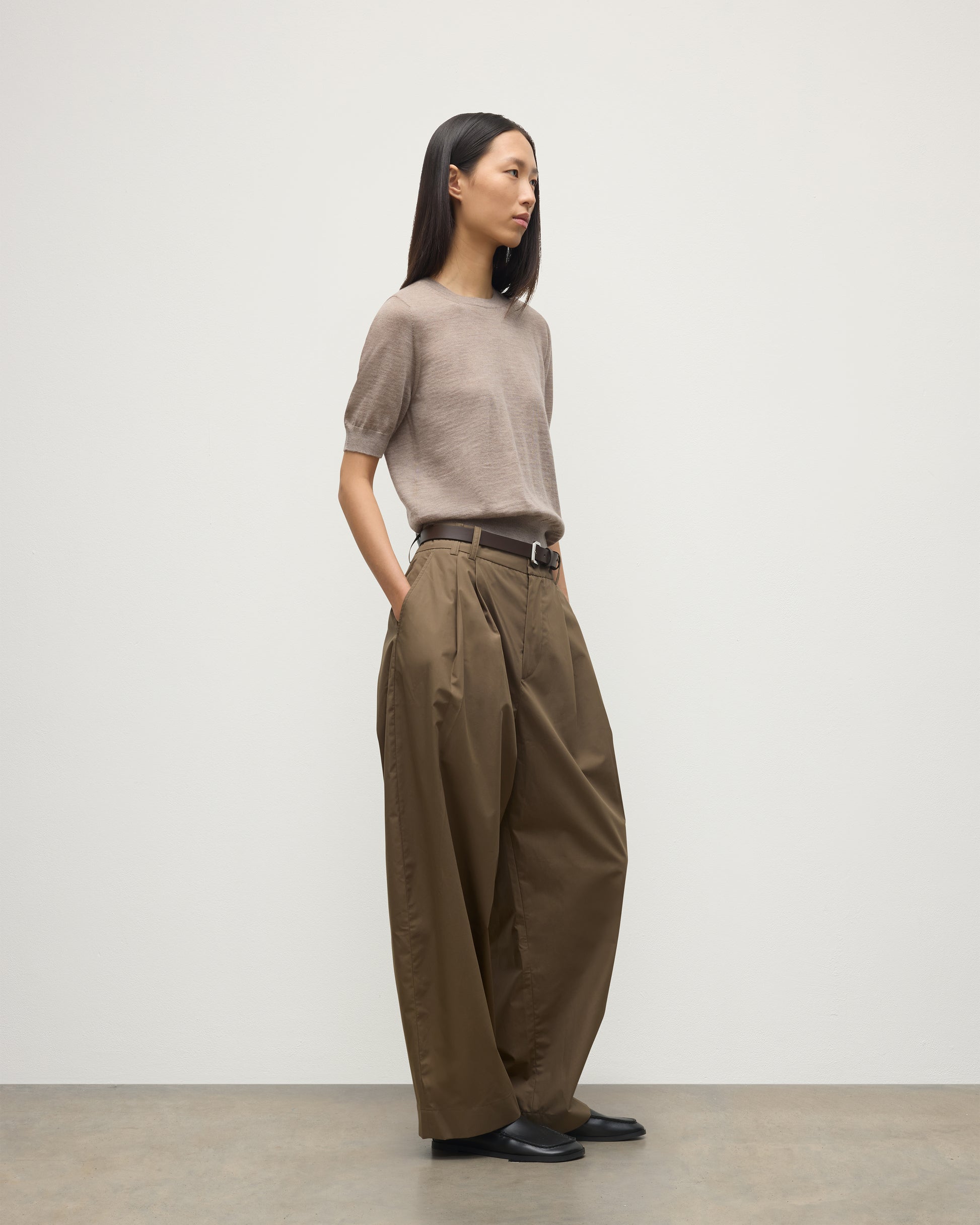 MODEL WEARING JOHNSTONS OF ELGIN WOMENS HONOR SHORT SLEEVE CREW LIGHT BROWN 100% SUPERFINE CASHMERE WITH BROWN WIDE LEG TROUSER KAI05712HB0273