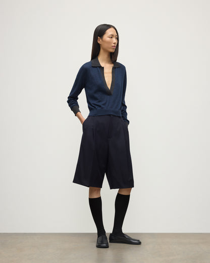 MODEL WEARS JOHNSTONS OF ELGIN WOMENS DEE SHIRT NAVY & GREY 100% SUPERFINE CASHMERE WITH NAVY LONG SHIRTS< SOCKS AND LOAFERS KAI05713Q25962