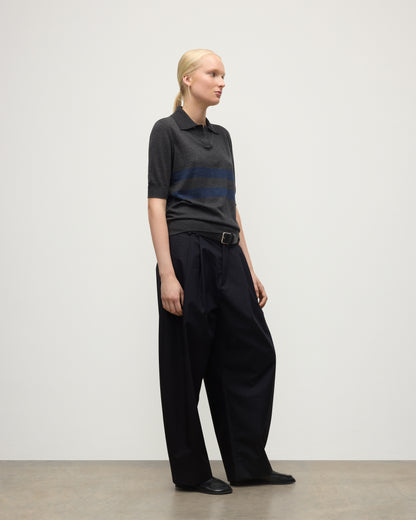 MODEL WEARS JOHNSTONS OF ELGIN WOMENS COIRA SHORT SLEEVE SHIRT GREY & NAVY 100% SUPERFINE CASHMERE WITH BLACK TROUSERS KAI05714Q25955