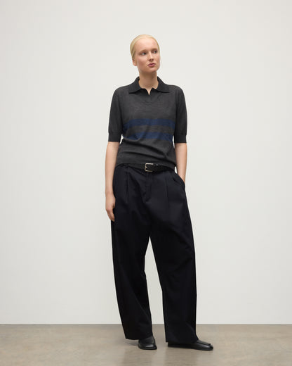 MODEL WEARS JOHNSTONS OF ELGIN WOMENS COIRA SHORT SLEEVE SHIRT GREY & NAVY 100% SUPERFINE CASHMERE WITH BLACK TROUSERS KAI05714Q25955