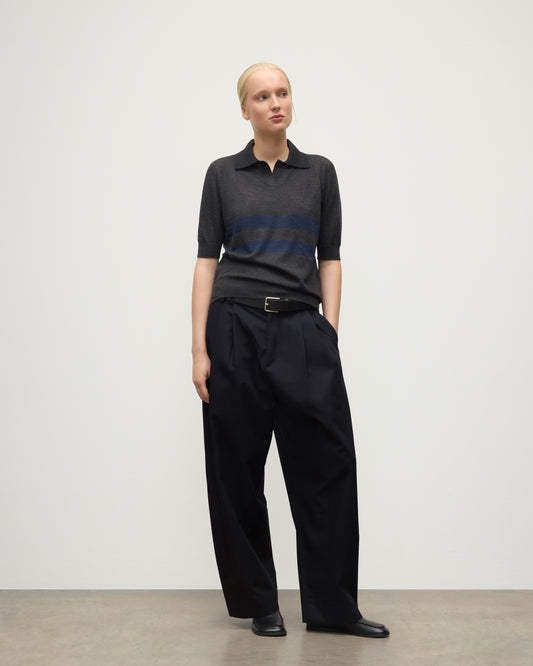 MODEL WEARS JOHNSTONS OF ELGIN WOMENS COIRA SHORT SLEEVE SHIRT GREY & NAVY 100% SUPERFINE CASHMERE WITH BLACK TROUSERS KAI05714Q25955