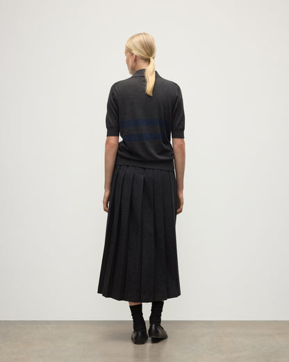 MODEL WEARS JOHNSTONS OF ELGIN WOMENS COIRA SHORT SLEEVE SHIRT GREY & NAVY 100% SUPERFINE CASHMERE WITH LE KILT CHARCOAL LONG KILT KAI05714Q25955