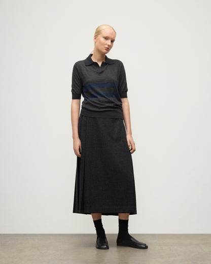 MODEL WEARS JOHNSTONS OF ELGIN WOMENS COIRA SHORT SLEEVE SHIRT GREY & NAVY 100% SUPERFINE CASHMERE WITH LE KILT CHARCOAL LONG KILT KAI05714Q25955