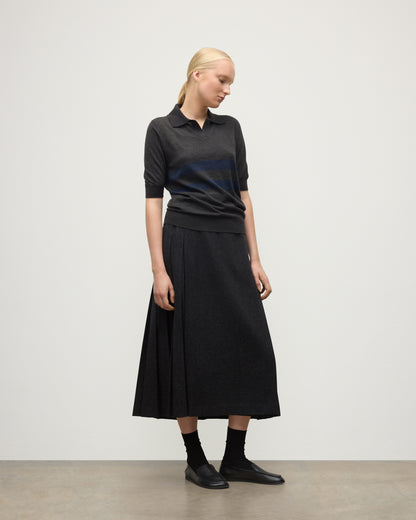 MODEL WEARS JOHNSTONS OF ELGIN WOMENS COIRA SHORT SLEEVE SHIRT GREY & NAVY 100% SUPERFINE CASHMERE WITH LE KILT CHARCOAL LONG KILT KAI05714Q25955