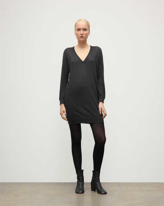 MODEL WEARING JOHNSTONS OF ELGIN WOMENS ELISE VEE SWEATER GREY 100% SUPERFINE CASHMERE WITH BLACK TIGHTS AND BOOTS KAI05715HA7218