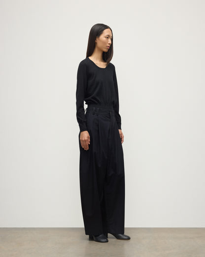 MODEL WEARING JOHNSTONS OF ELGIN WOMENS ELLA SCOOP SWEATER BLACK WITH BLACK TROUSERS KAI05723SA7146