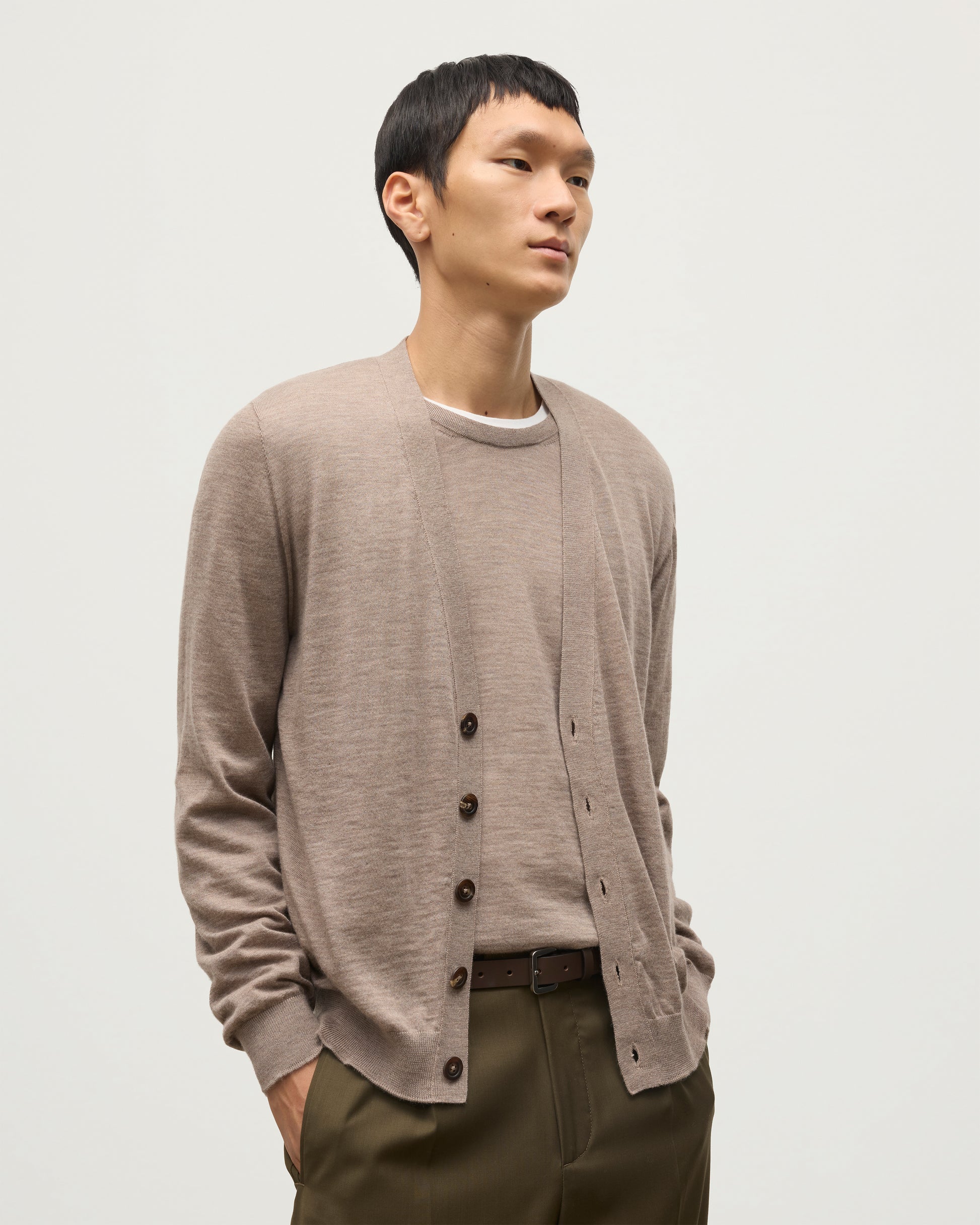 MALE MODEL WEARING JOHNSTONS OF ELGIN FORSYTH SUPERFINE VEE NECK CARDIGAN LIGHT BROWN  KAI05740HB0273