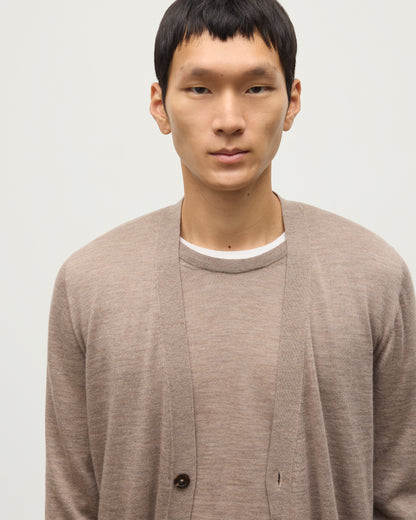 MALE MODEL WEARING JOHNSTONS OF ELGIN FORSYTH SUPERFINE VEE NECK CARDIGAN LIGHT BROWN  OVER A MATCHING SUPERFINE CASHMERE SWEATER KAI05740HB0273