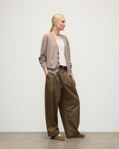 FEMALE MODEL WEARING JOHNSTONS OF ELGIN FORSYTH SUPERFINE VEE NECK CARDIGAN LIGHT BROWN WITH BROWN WIDE LEG TROUSERS KAI05740HB0273