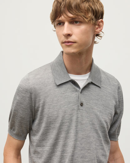 MODEL WEARS JOHNSTONS OF ELGIN MENS FIN SHORT SLEEVE SUPERFINE POLOSHIRT GREY OVER A WHITE T-SHIRT KAI05741HA4253