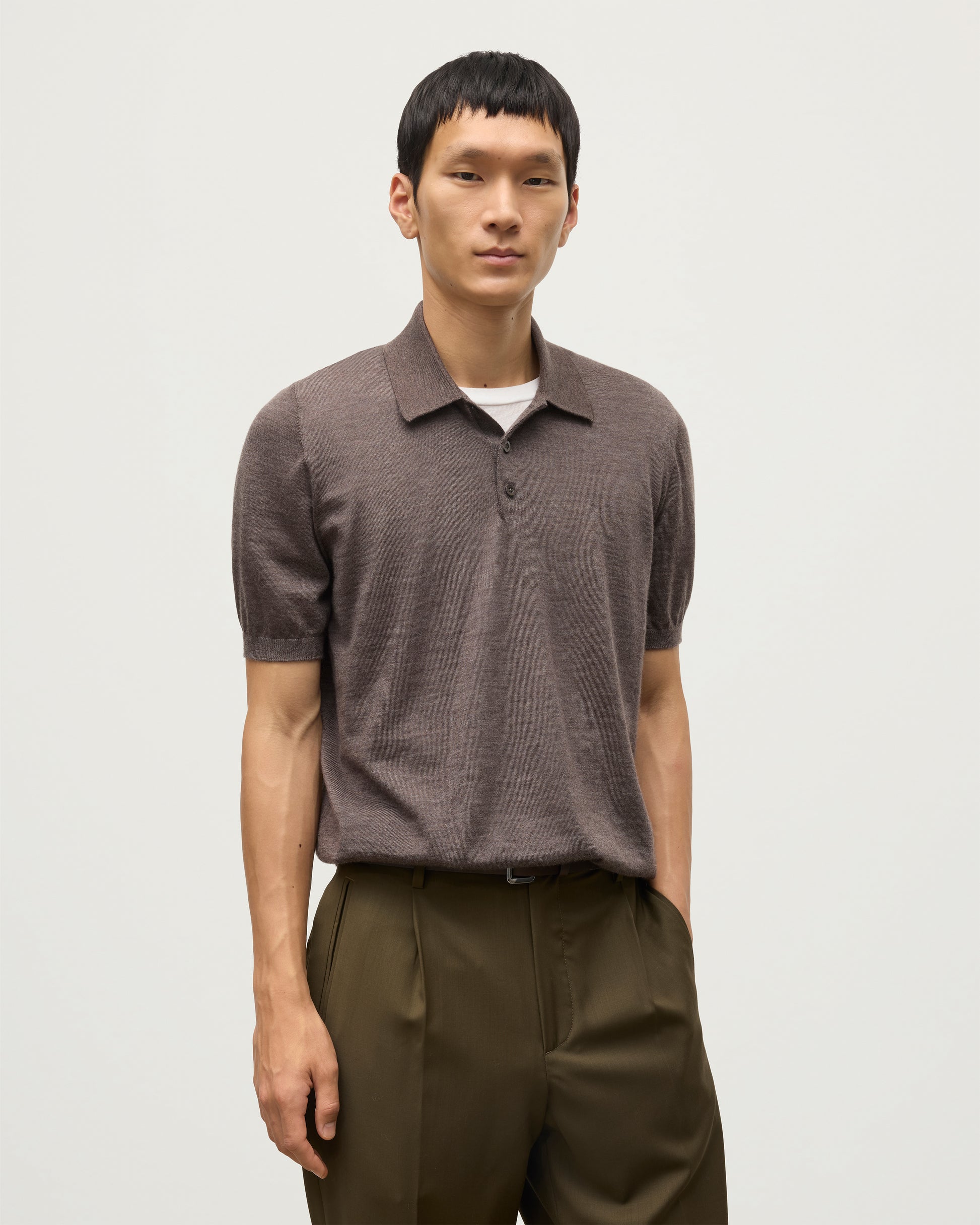 MODEL WEARS JOHNSTONS OF ELGIN MENS FIN SHORT SLEEVE SUPERFINE POLOSHIRT LIGHT BROWN KAI05741HB7092