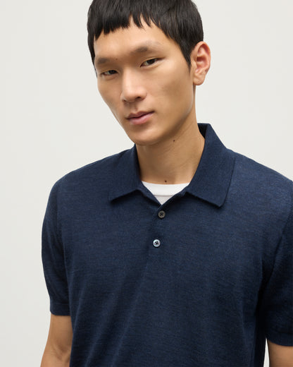 MODEL WEARS JOHNSTONS OF ELGIN MENS FIN SHORT SLEEVE SUPERFINE POLOSHIRT NAVY OVER A WHITE T-SHIRT KAI05741HD7350
