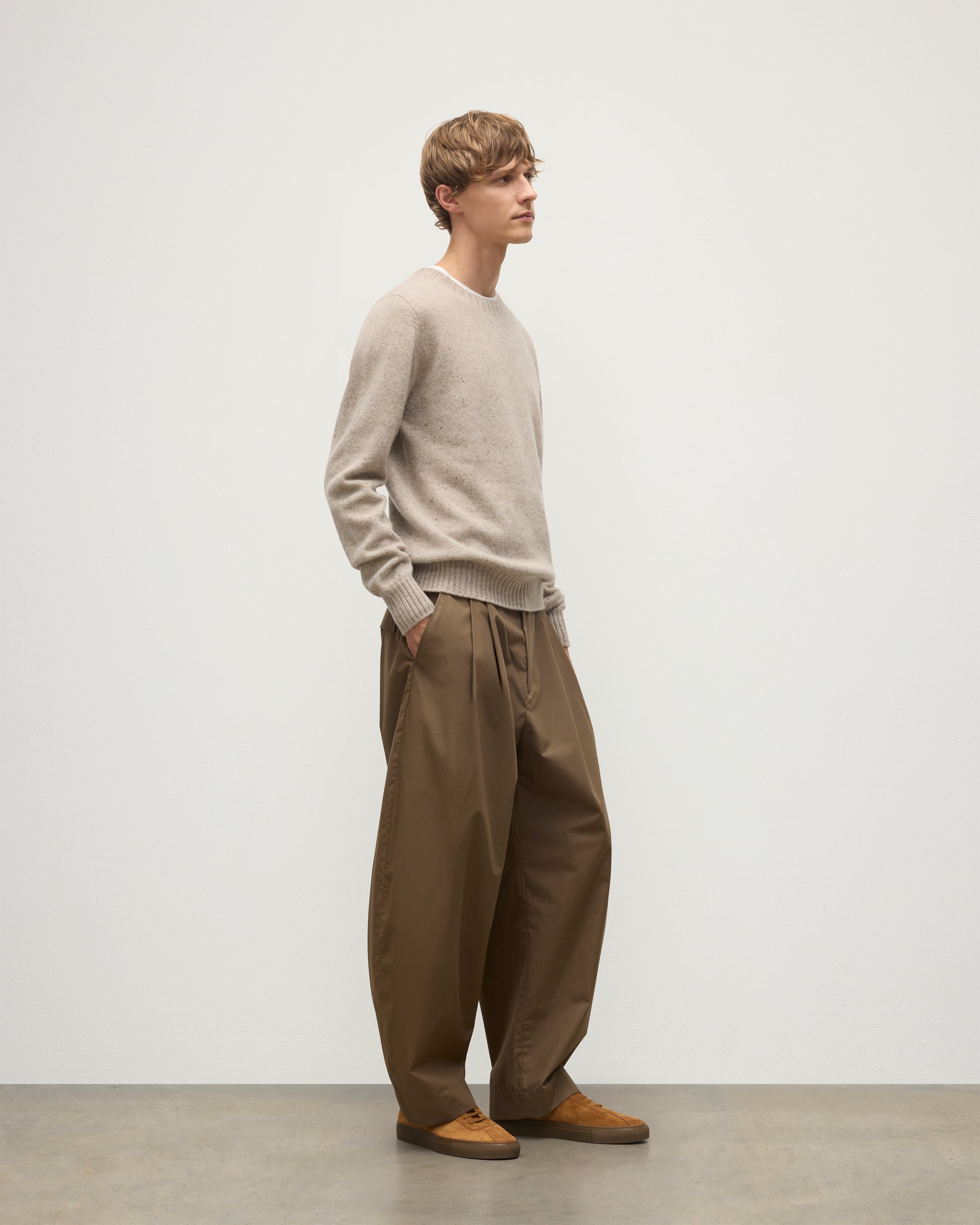 MENS TIREE CREW SWEATER NATURAL 100% DONEGAL CASHMERE BY JOHNSTONS OF ELGIN, OVER A WHITE TEE WITH GREEN TROUSERS KAI05755HA0397