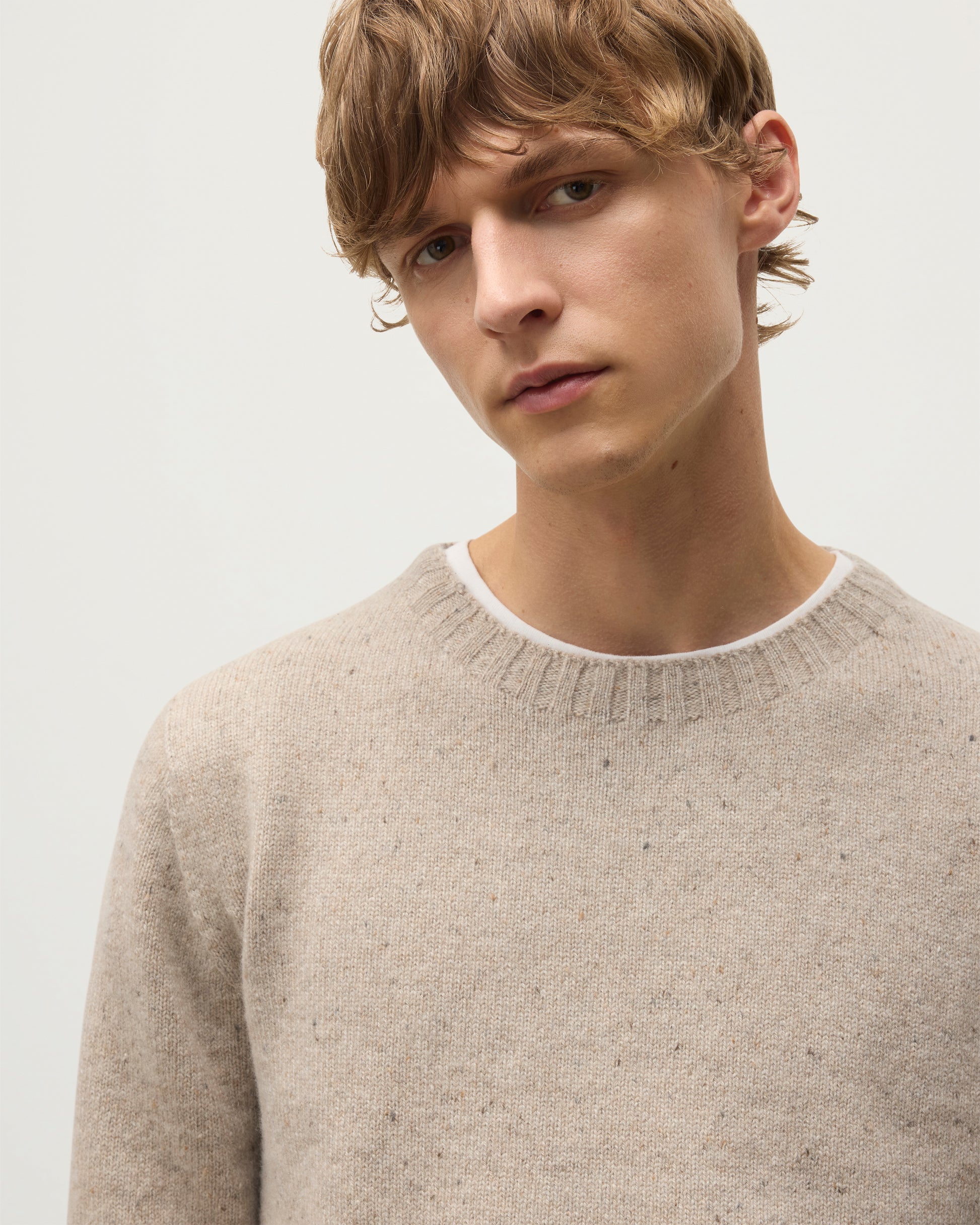 MENS TIREE CREW SWEATER NATURAL 100% DONEGAL CASHMERE BY JOHNSTONS OF ELGIN, OVER A WHITE TEE WITH GREEN TROUSERS KAI05755HA0397