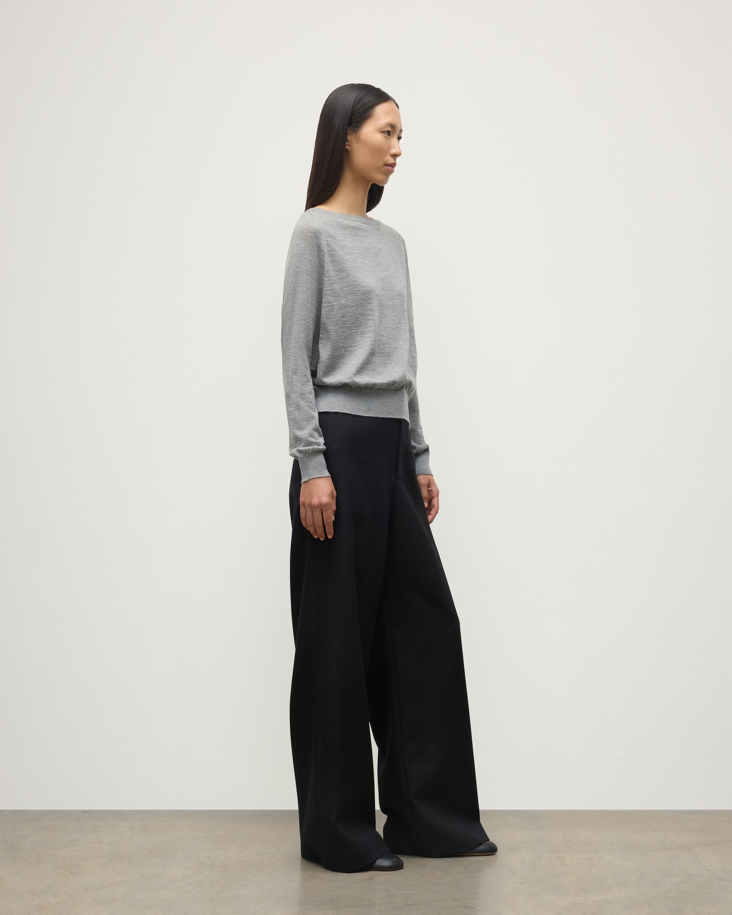 MODEL WEARS JOHNSTONS OF ELGIN WOMENS FINOLA SWEATER GREY WITH BLACK TROUSERS KAI05789HA4253