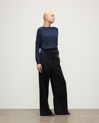 MODEL WEARS JOHNSTONS OF ELGIN WOMENS FINOLA SWEATER NAVY 100% SUPERFINE CASHMERE  WITH BLACK TROUSERS KAI05789HD7350