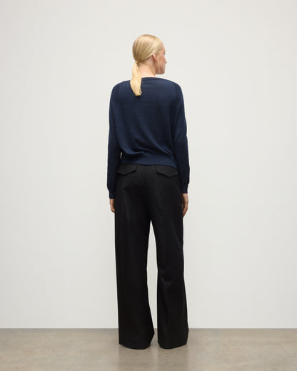 MODEL WEARS JOHNSTONS OF ELGIN WOMENS FINOLA SWEATER NAVY 100% SUPERFINE CASHMERE  WITH BLACK TROUSERS KAI05789HD7350