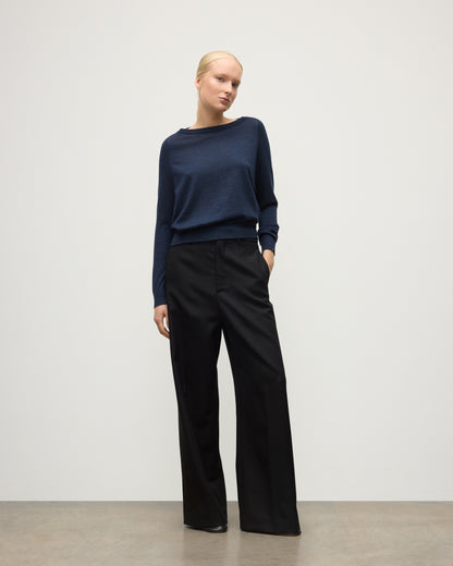 MODEL WEARS JOHNSTONS OF ELGIN WOMENS FINOLA SWEATER NAVY 100% SUPERFINE CASHMERE  WITH BLACK TROUSERS KAI05789HD7350