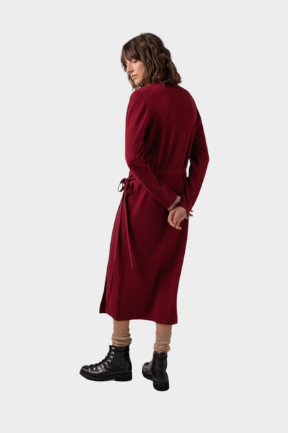 Back of Johnstons of Elgin Ballet Wrap Cashmere Dress in Wine worn with Cashmere Socks & Shoes on a grey background KAP05047SE6162