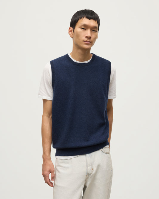 MODEL WEARS JOHNSTONS OF ELGIN MENS LENNOX SLEEVELESS CREW NAVY 100% CASHMERE KAP05243HD7350