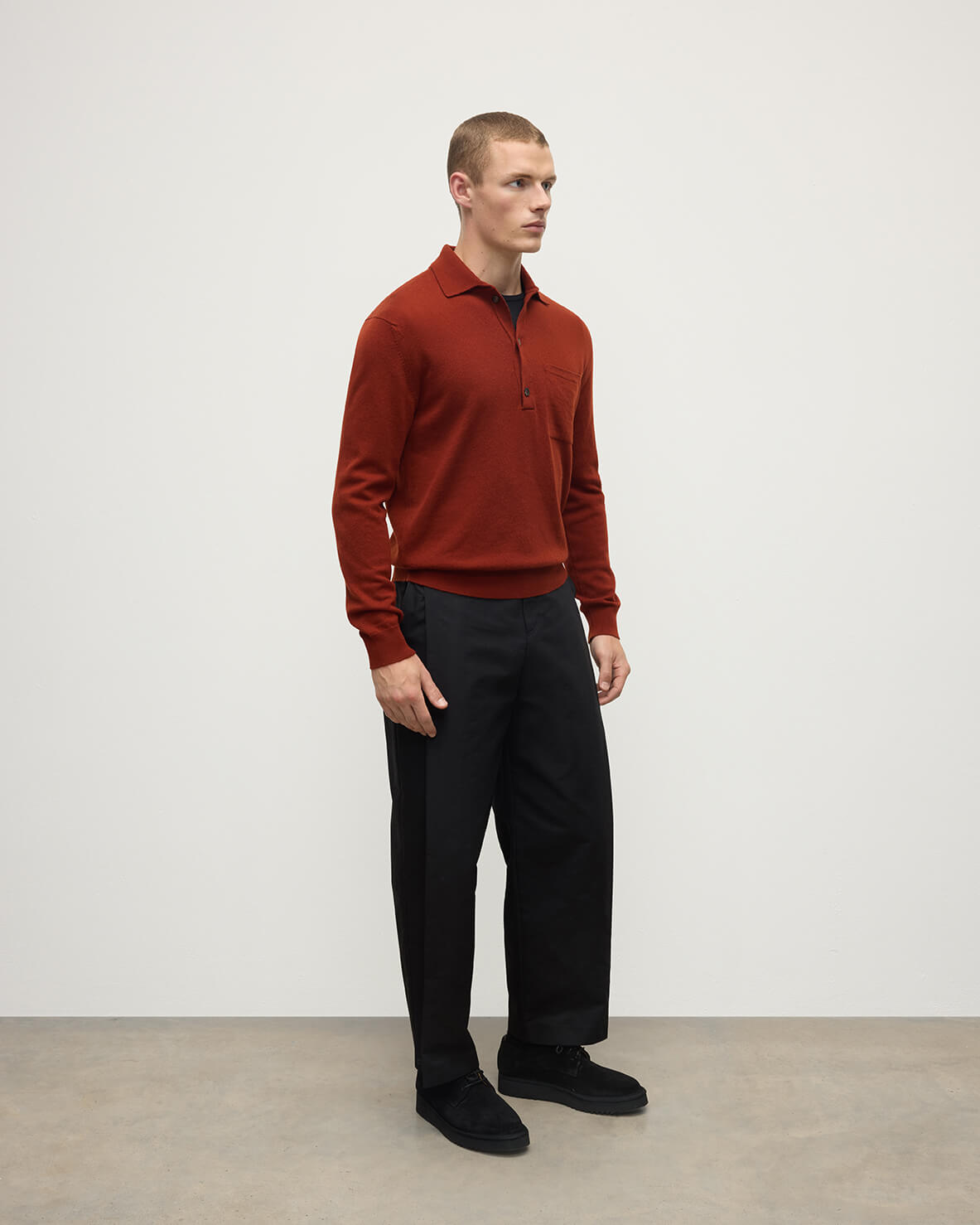 Model wearing Johnstons of Elgin AW25 Men's Knitwear Oxblood Cashmere Long Sleeve Red Polo shirt  Side view KAP05268Q25358
