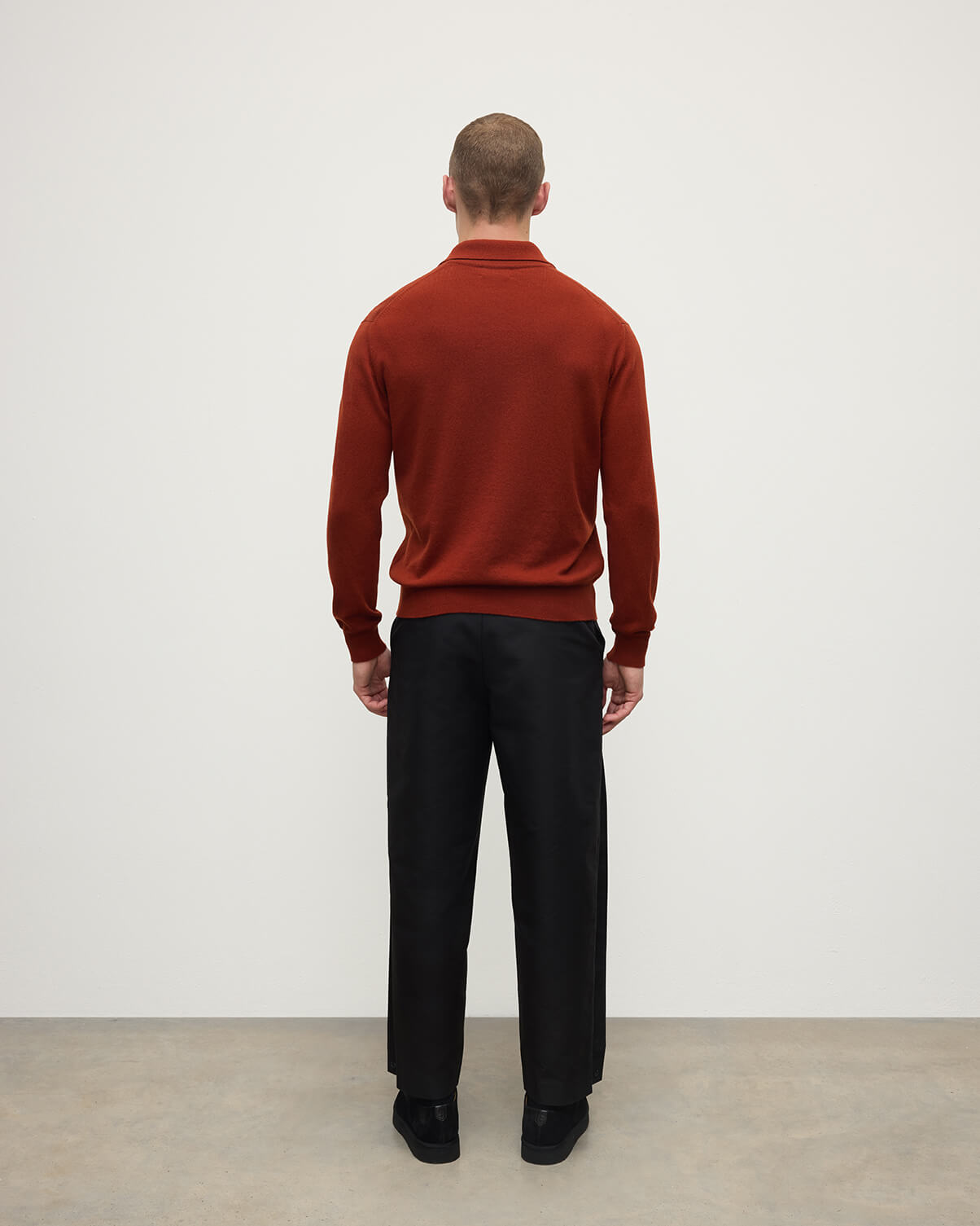 Model wearing Johnstons of Elgin AW25 Men's Knitwear Oxblood Cashmere Long Sleeve Red Polo shirt  Back view KAP05268Q25358