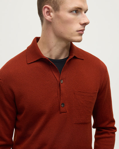 Model wearing Johnstons of Elgin AW25 Men's Knitwear Oxblood Cashmere Long Sleeve Red Polo shirt  details view KAP05268Q25358