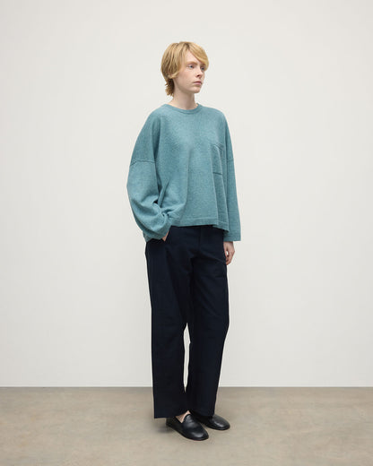 Model wearing Johnstons of Elgin AW25 Women's Knitwear Seascape Gauzy Pocket Green Cashmere Jumper Side View  KAP05315HC0038