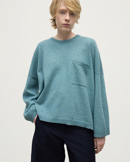 Model wearing Johnstons of Elgin AW25 Women's Knitwear Seascape Gauzy Pocket Green Cashmere Jumper Close Up KAP05315HC0038