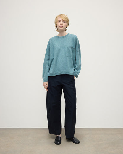 Model wearing Johnstons of Elgin AW25 Women's Knitwear Seascape Gauzy Pocket Green Cashmere Jumper Front View  KAP05315HC0038