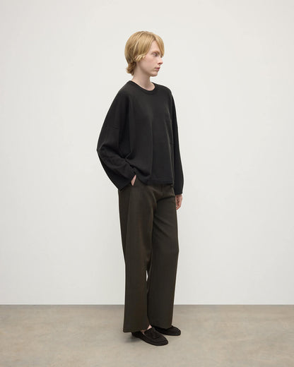 Model wears Johnstons of Elgin AW25 Women's Knitwear Iron Pocket Grey Cashmere Jumper Side  View KAP05315SC7330