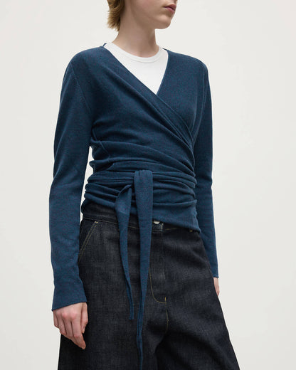 Model wears Johnstons of Elgin AW25 Women's Knitwear Heather Navy Ballet Wrap Navy Cashmere Cardigan Close Up  KAP05408HD7321