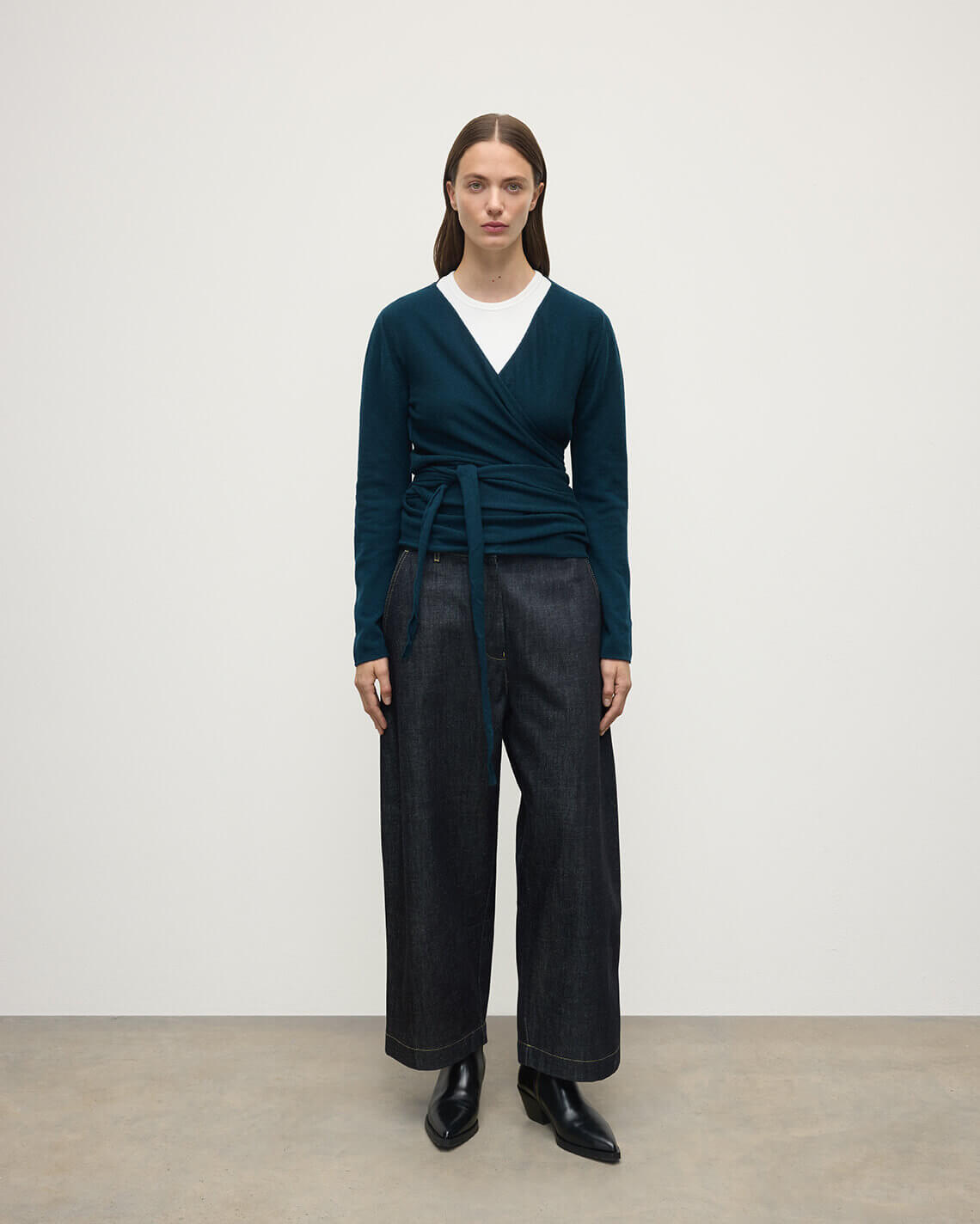 Model wearing Johnstons of Elgin AW25 Women's Knitwear Bottle Green Ballet Wrap Green Cashmere Cardigan Front View KAP05408SC7341