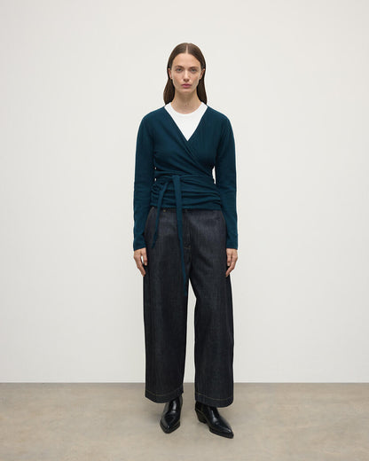 Model wearing Johnstons of Elgin AW25 Women's Knitwear Bottle Green Ballet Wrap Green Cashmere Cardigan Front View KAP05408SC7341