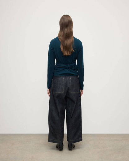 Model wearing Johnstons of Elgin AW25 Women's Knitwear Bottle Green Ballet Wrap Green Cashmere Cardigan Back View KAP05408SC7341